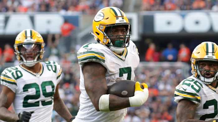 Packers LB Quay Walker returns an interception for a touchdown at Chicago.